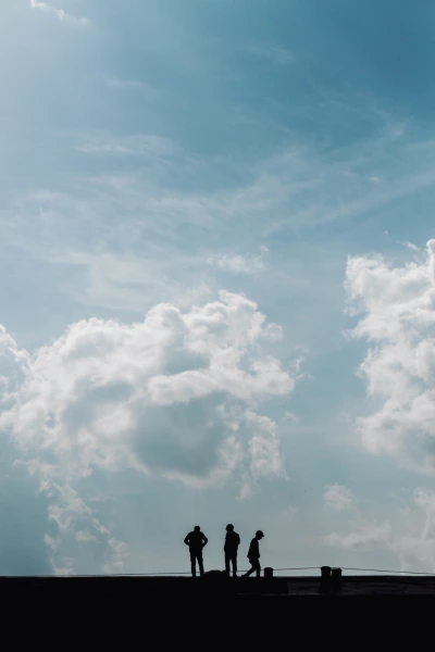 three men on a roof